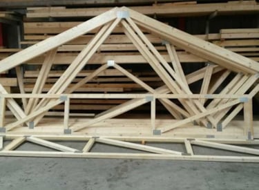 Wooden building materials connected with metal nail plates