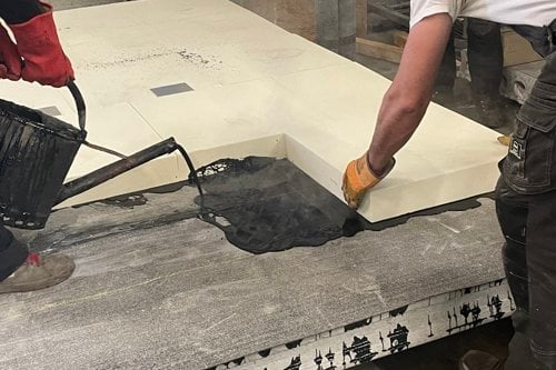 Dakopbouw gieten met gieter